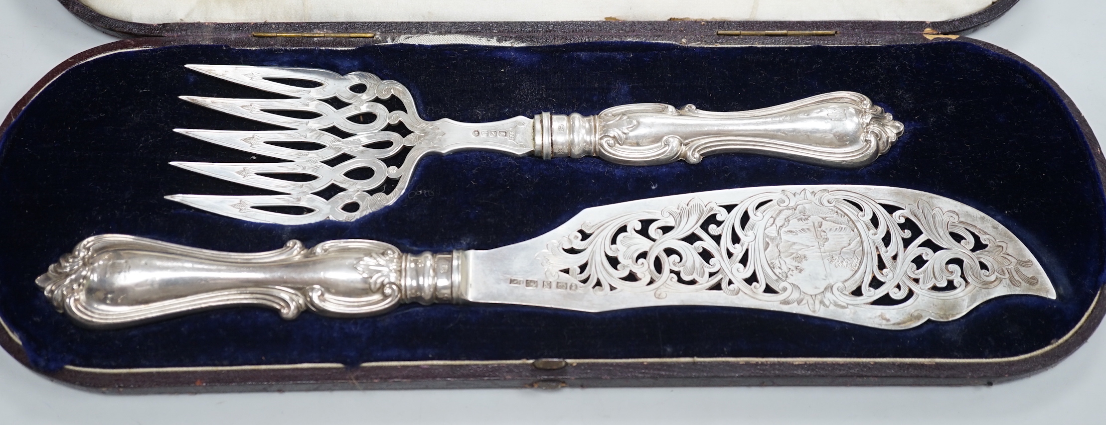 A cased pair of Victorian silver fish servers, Henry Howson, Sheffield, 1856, knife 33.8cm.